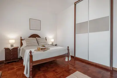 a bedroom with a bed and a glass wall at Casa Nóbrega, By OP in Funchal