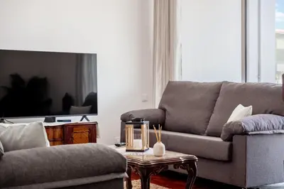 a living room with a couch and a coffee table at Casa Nóbrega, By OP in Funchal