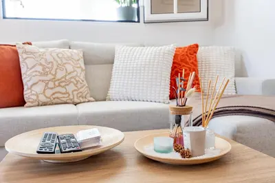 a living room with a couch and a coffee table at Hibiscus House by YOUR KEY in Calheta