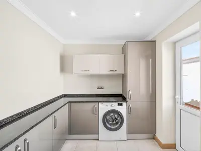 a bathroom with two sinks and a shower at Vila Girassol in Lagos
