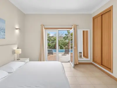 a large living room with a couch and a table at Vila Limoeiro in Lagos