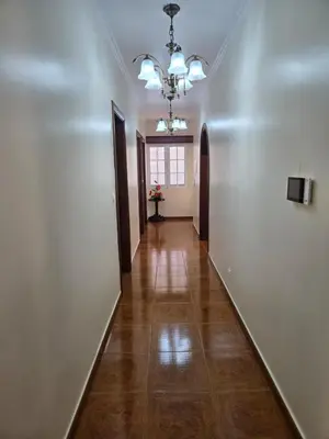 a hallway with a white wall and a ceiling at Villa Pedro, Big House in Calheta