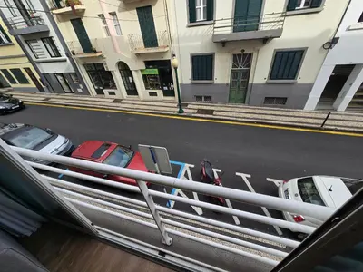 a group of cars parked in a parking lot at Zen Space in Funchal