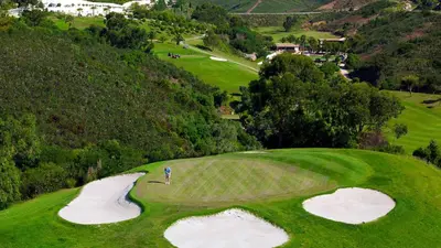 an aerial view of a golf course with two golf greens at VilaMar in Salema