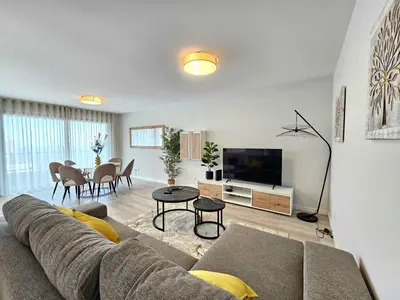 a living room with a couch and a tv at Vista Mar Garajau II by Rentallido in Caniço