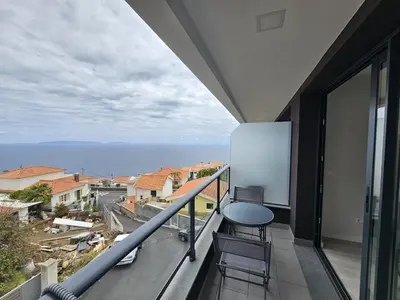 a balcony with a view of the ocean at Vista Mar Garajau II by Rentallido in Caniço