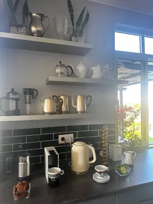a kitchen with pots and pans on a counter at Miguels Seaview Corner in Ponta do Sol