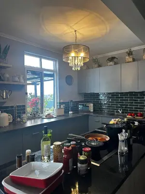a kitchen with a stove and a counter top at Miguels Seaview Corner in Ponta do Sol