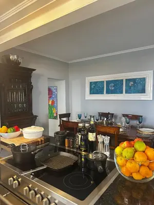 a kitchen with a bowl of fruit on a counter at Miguels Seaview Corner in Ponta do Sol