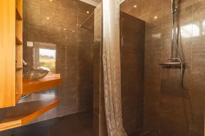 a bathroom with a shower and a sink at Cape View Villa by Atlantic Holiday in Ponta do Pargo