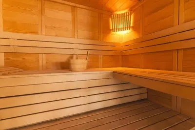 a wooden sauna with a bucket in it at Cape View Villa by Atlantic Holiday in Ponta do Pargo