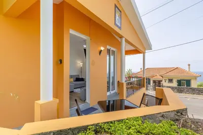 a view from the balcony of a house at Coastal São Vicente Mountain & Sea View Hideaway with Free Parking in São Vicente