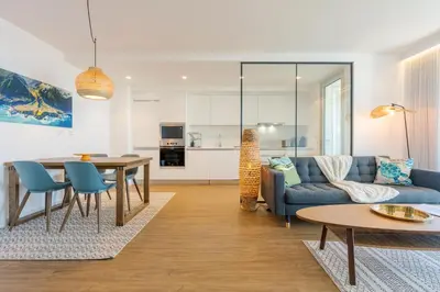 a living room with a couch and a table at Atlantic Nest Apartment by Holiday Rental Madeira in Câmara de Lobos