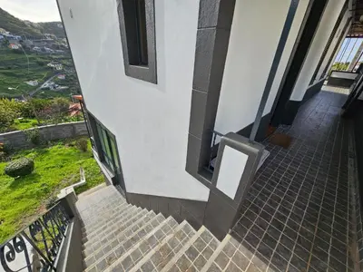 a stairway leading up to a building with a window at Villa Rodrigues 3 by Rentallido in Campanário