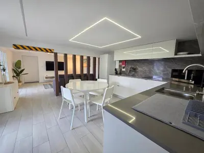 a kitchen with a table and chairs in a room at Villa Rodrigues 3 by Rentallido in Campanário