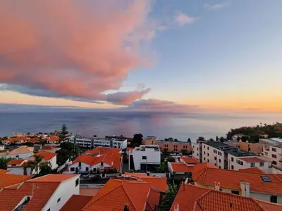 a view of a city with orange roofs at Garajau Residence Sea View by Rentallido in Caniço