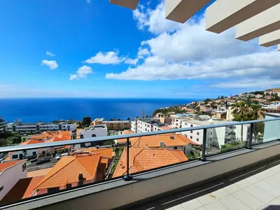 a view of the ocean from the balcony of a building at Garajau Residence Sea View by Rentallido in Caniço