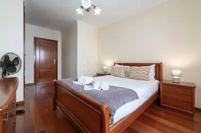 a bedroom with a bed with two towels on it at Recanto do Estreito by GALMI in Estreito da Calheta