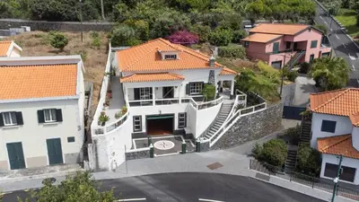 an aerial view of a house in a city at Recanto do Estreito by GALMI in Estreito da Calheta