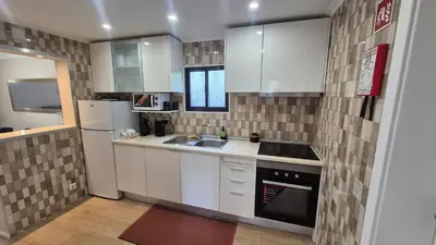 a microwave sitting on top of a kitchen counter at Chalé da Serra in Santo da Serra