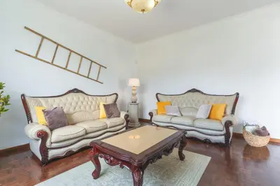 a living room with two couches and a coffee table at Casa do Pico by Atlantic Holiday in Câmara de Lobos