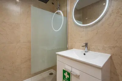 a bathroom with a sink and a mirror at Lovely beach apartment, sea views, rooftop terrace #1974 in Budens