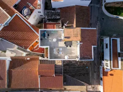 an overhead view of roofs of buildings at Lovely beach apartment, sea views, rooftop terrace #1974 in Budens