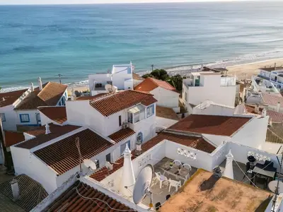 an aerial view of a white house and the ocean at Lovely beach apartment, sea views, rooftop terrace #1974 in Budens