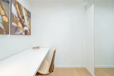 a white table in a white room with a painting at Nora Charming Apartment - Pool -10m Walk City Center in Funchal