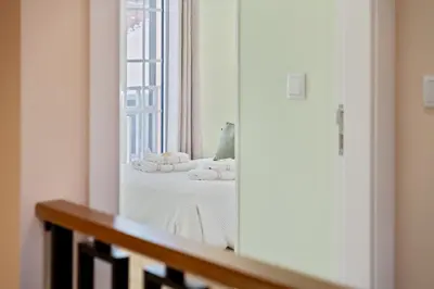 a mirror in a room with a table with towels at Achada by Homie in Funchal