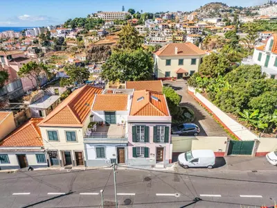 an aerial view of a neighborhood with houses at Achada by Homie in Funchal