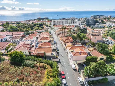 an aerial view of a city with buildings and the ocean at Achada by Homie in Funchal