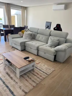 a living room with a couch and a coffee table at luz beach home in Luz