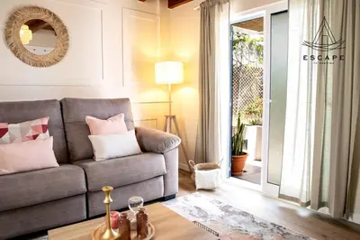 a living room with a couch and a table at Izzys Place by ESCAPE to Madeira in Ponta do Sol