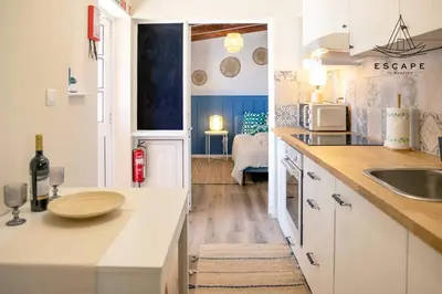 a kitchen with a sink and a counter top at Izzys Place by ESCAPE to Madeira in Ponta do Sol