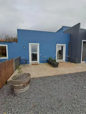 a blue building with a patio in front of it at Casa Solar do Tristão in Santa Maria Madalena
