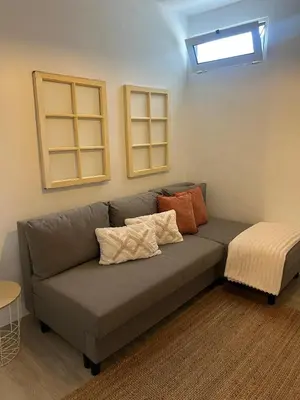 a couch with pillows on it in a room at Casa Solar do Tristão in Santa Maria Madalena