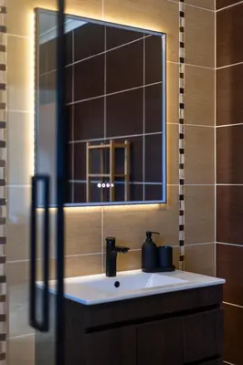a bathroom with a sink and a mirror at Sagres ZEN - 3 Bedroom House in Sagres
