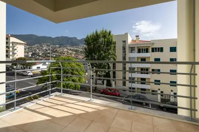 an apartment balcony with a view of a city at OurMadeira - Madalena Living Apt in Funchal