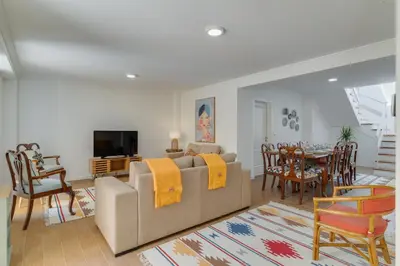 a living room with a couch and a dining room at Maria Madalena in Madalena do Mar