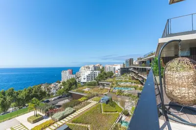 a balcony with a view of the ocean at Seaside Escape by Atlantic Holiday in Funchal