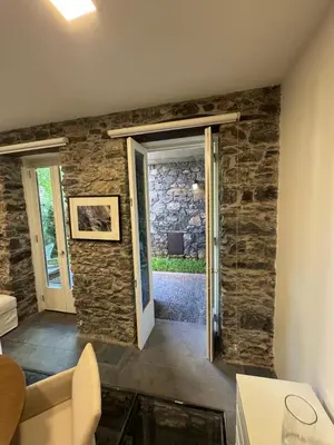 a room with a door and a stone wall at Atelier II by Real Vision in Funchal