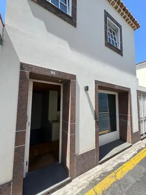 a building with the doors open on a street at Atelier II by Real Vision in Funchal