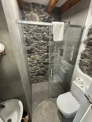 a bathroom with a shower and a toilet and a sink at Atelier II by Real Vision in Funchal