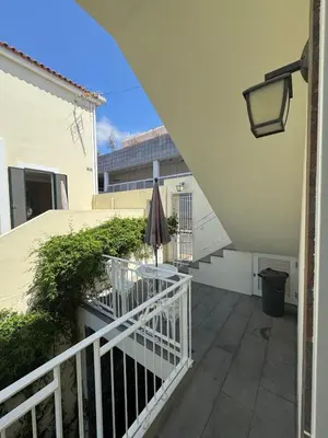 an open umbrella sitting on a balcony next to a building at Atelier II by Real Vision in Funchal