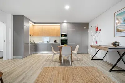 a kitchen and dining room with a table and chairs at MK Apart I in Funchal