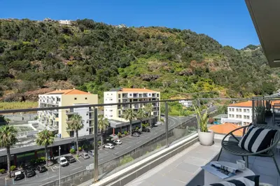 a view of the city from the balcony of a apartment at Wings Apartment II by An Island Apart in Santa Cruz