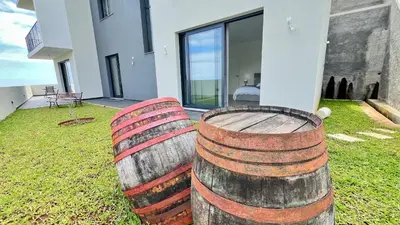 a building with a wall with the number on it at The Barreto's Clive in Ponta do Sol