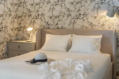 a bedroom with a bed with a hat on it at Monumental Studio 10 by An Island Apart in Funchal