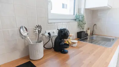 a kitchen counter with a kitchen utensils on the floor at Casa Calma II - 2 double bedrooms apartment in Luz